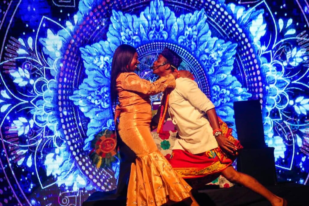 House of Naira performers under blue stage light