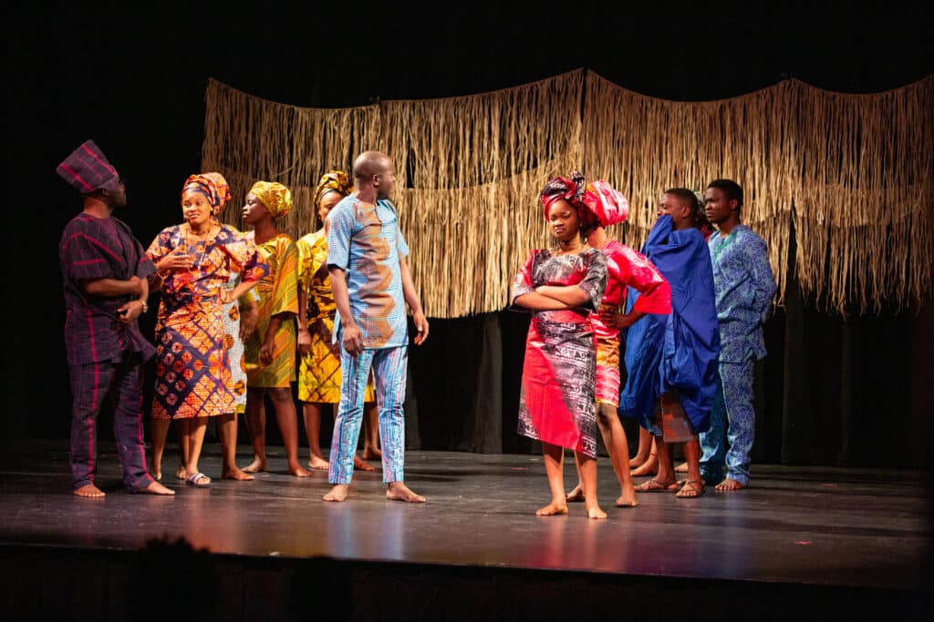 The company of A Journey to Africa on stage