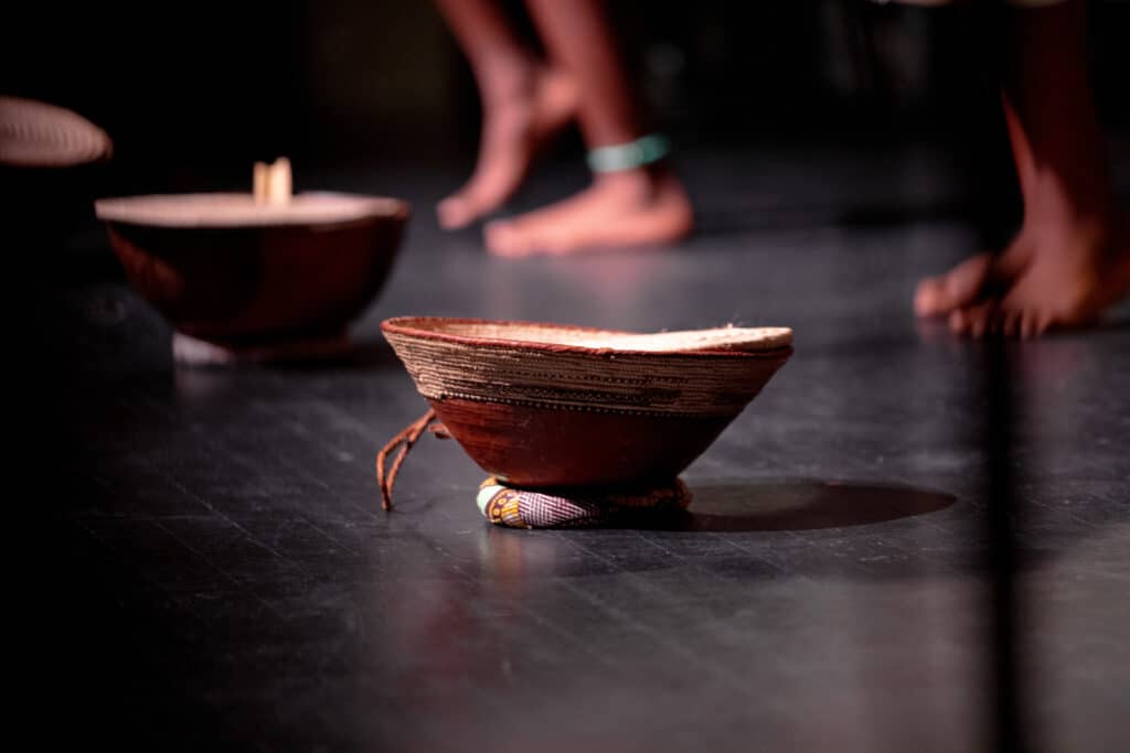 Calabash bowls on the stage floor in A Journey to Africa