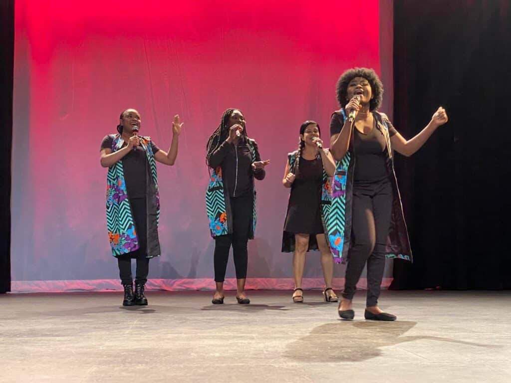 Soro Soke: performers sing under red stage light