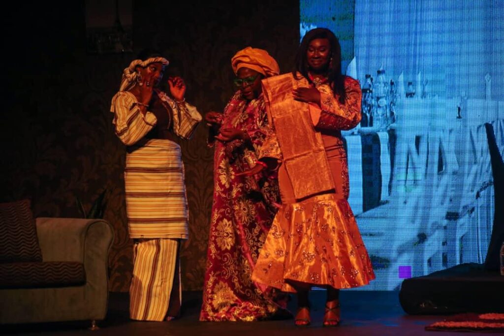 House of Naira performers in a family scene