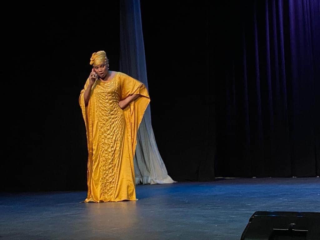 Soro Soke: a performer in a yellow gown on stage