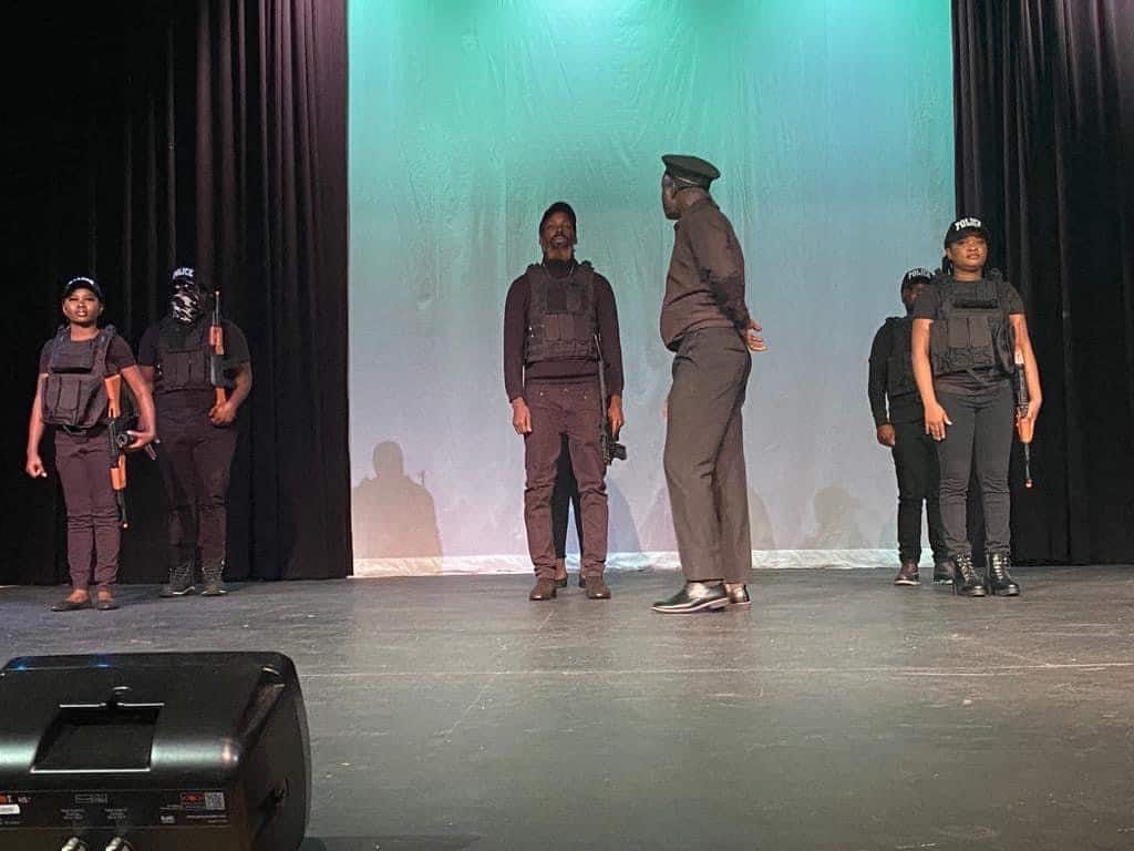 Soro Soke: officers in black uniforms on stage